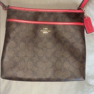 Authentic Coach purse. In great condition! Measurements | 12"L x 1.5"W x 11"H